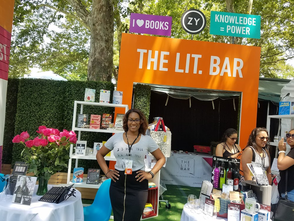 Noelle Santos at a book fair promoting Lit Bar