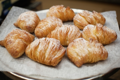 flaky ricotta-filled pastries called sfogliatelle from Caffè and Gelato  in the Arthur Avenue Retail Market 